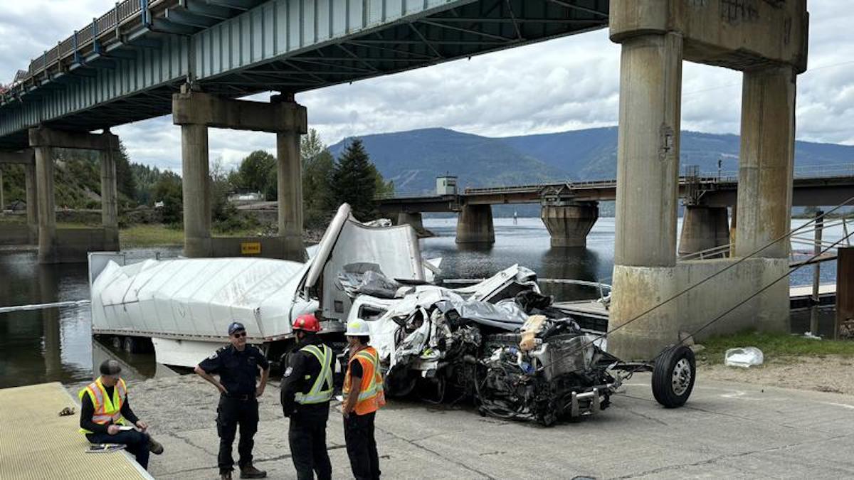 Trucker’s body pulled from river after plunging off bridge