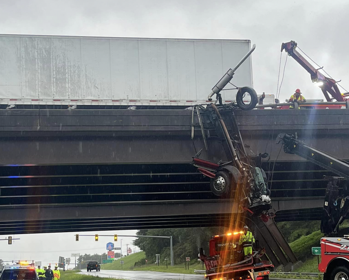 Truck driver charged in crash that left destroyed cab dangling from I-77 bridge in Virginia