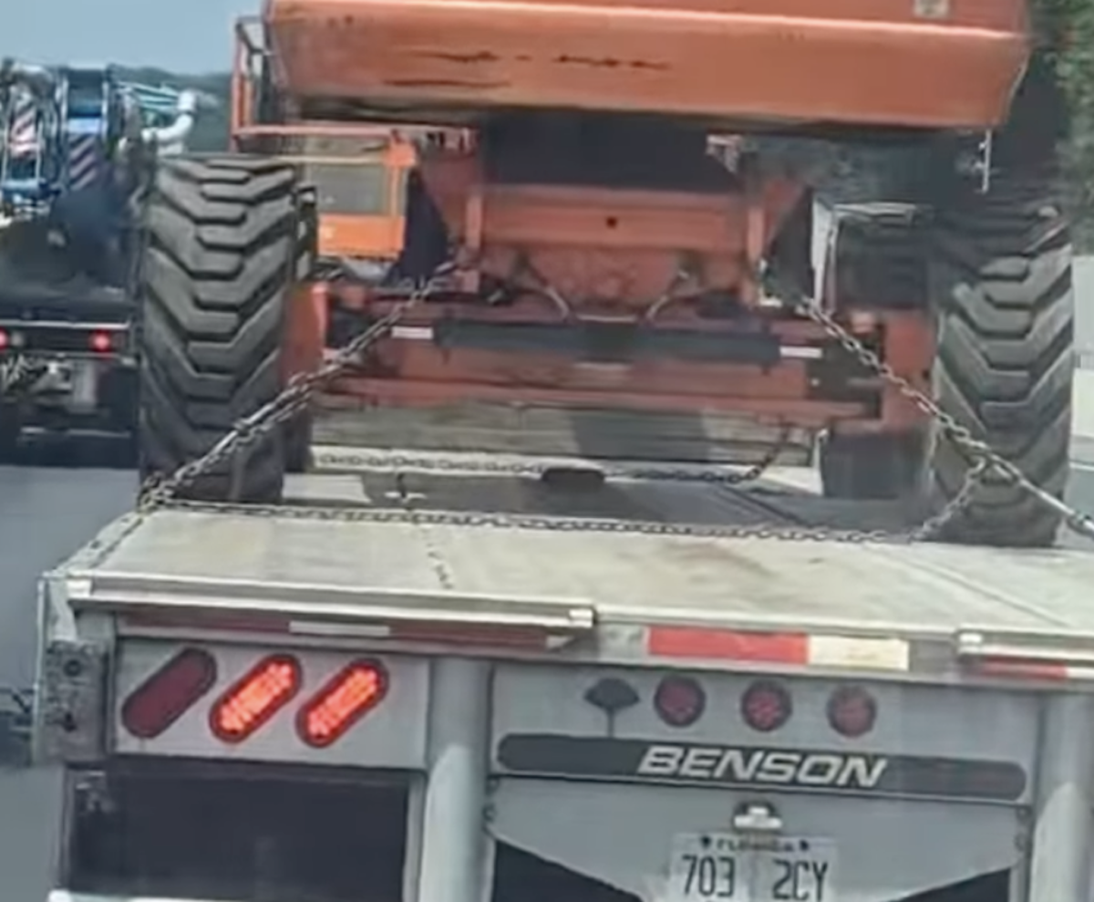 Police rescue kitten hitching a ride on flatbed semi truck