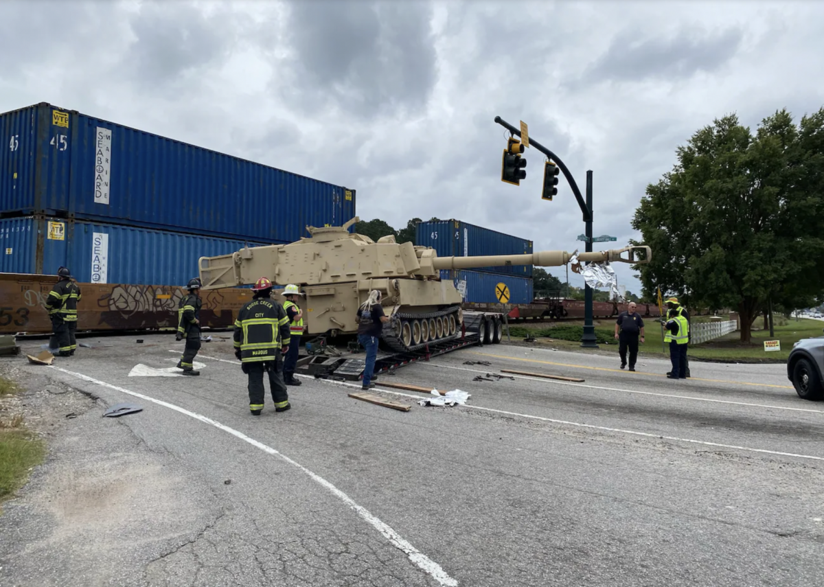 Semi truck hauling military vehicle hit by train, South Carolina cops say