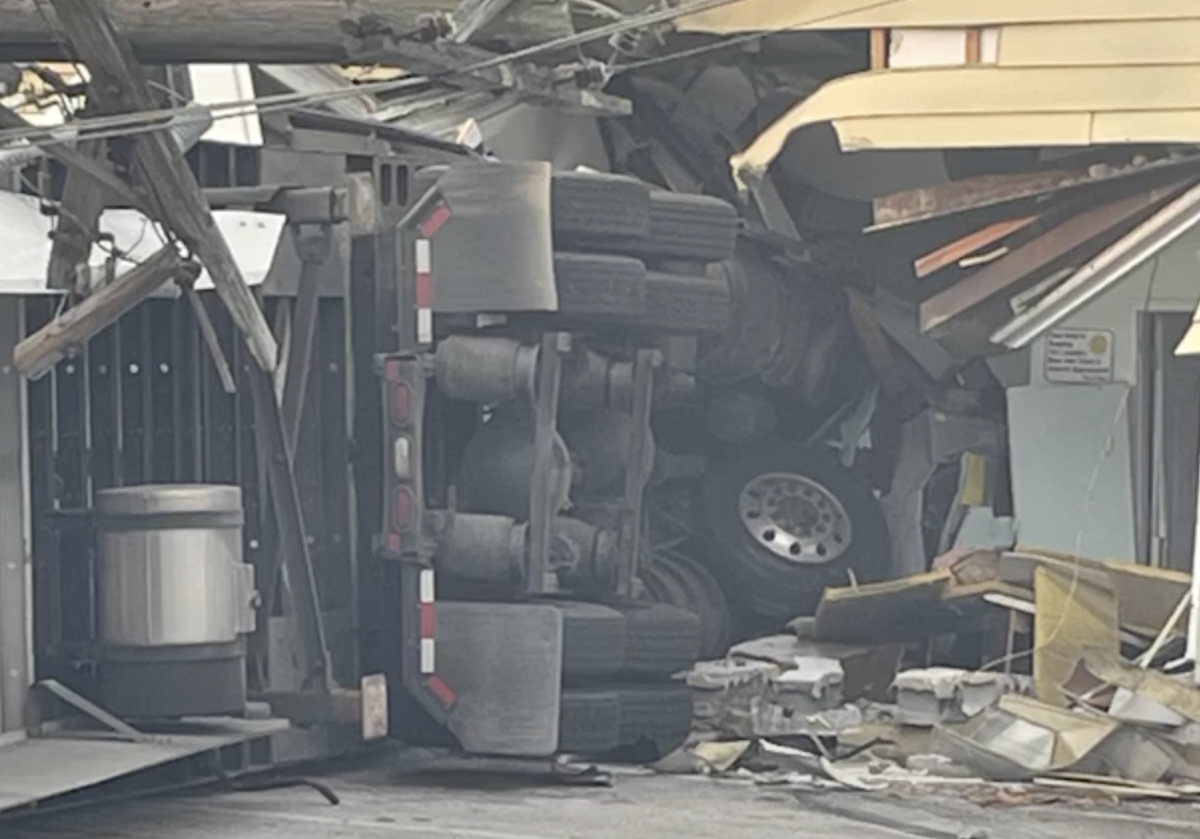 Driver airlifted after rig goes airborne and lands inside laundromat