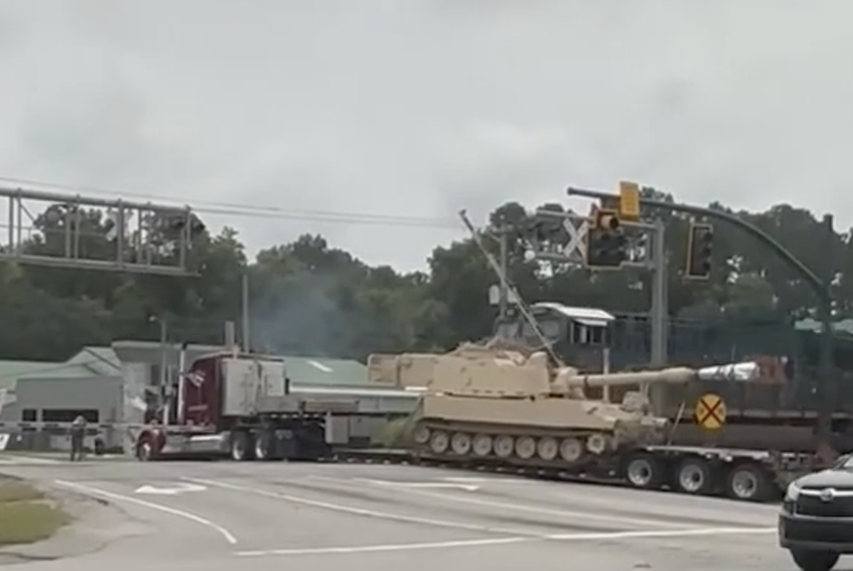 Watch the train collision that took out a military vehicle on a flatbed