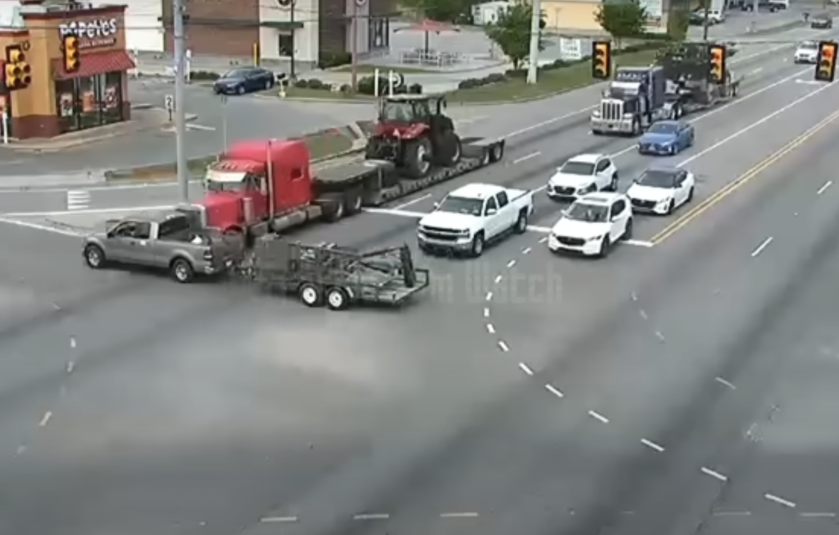 Red light running pickup gets creamed by flatbedder with a very secure load