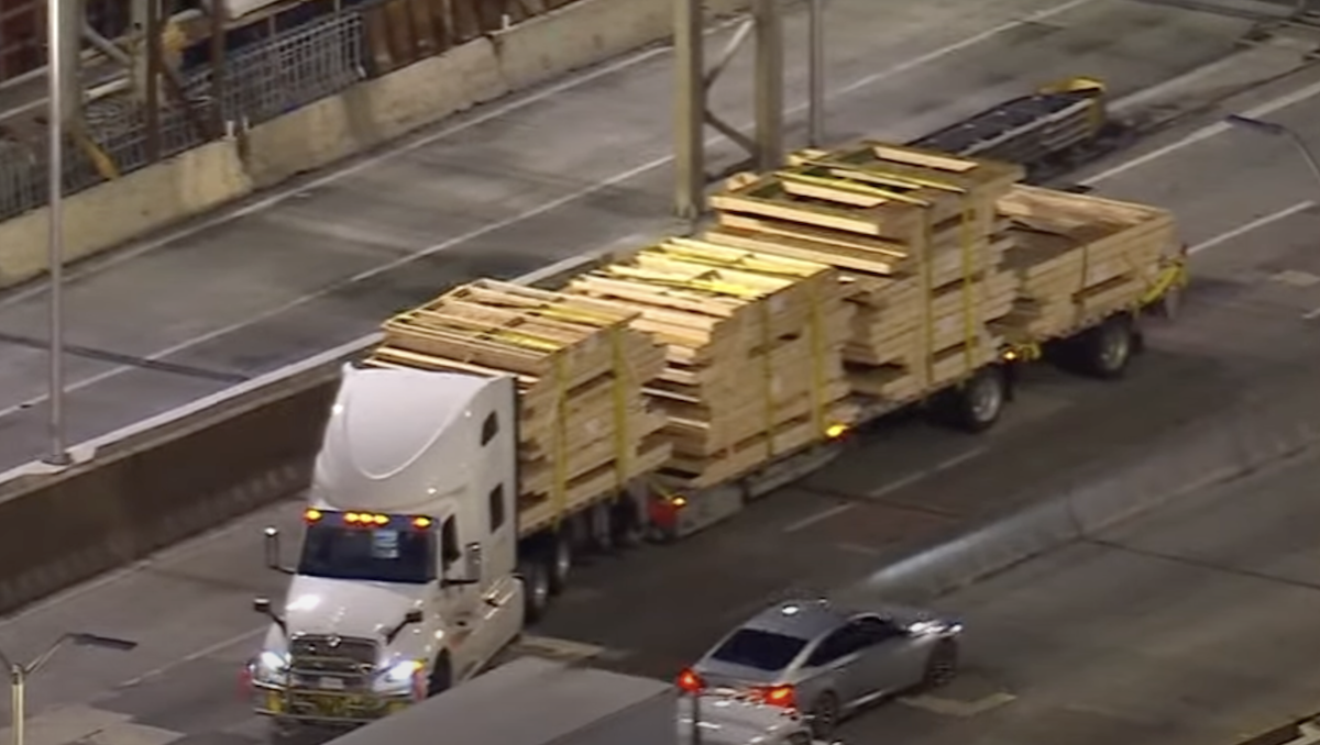 Police back semi truck off GWB after it smashes through toll plaza