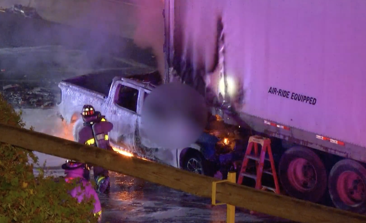 Driver manages to disconnect truck after woman smashes pickup into trailer