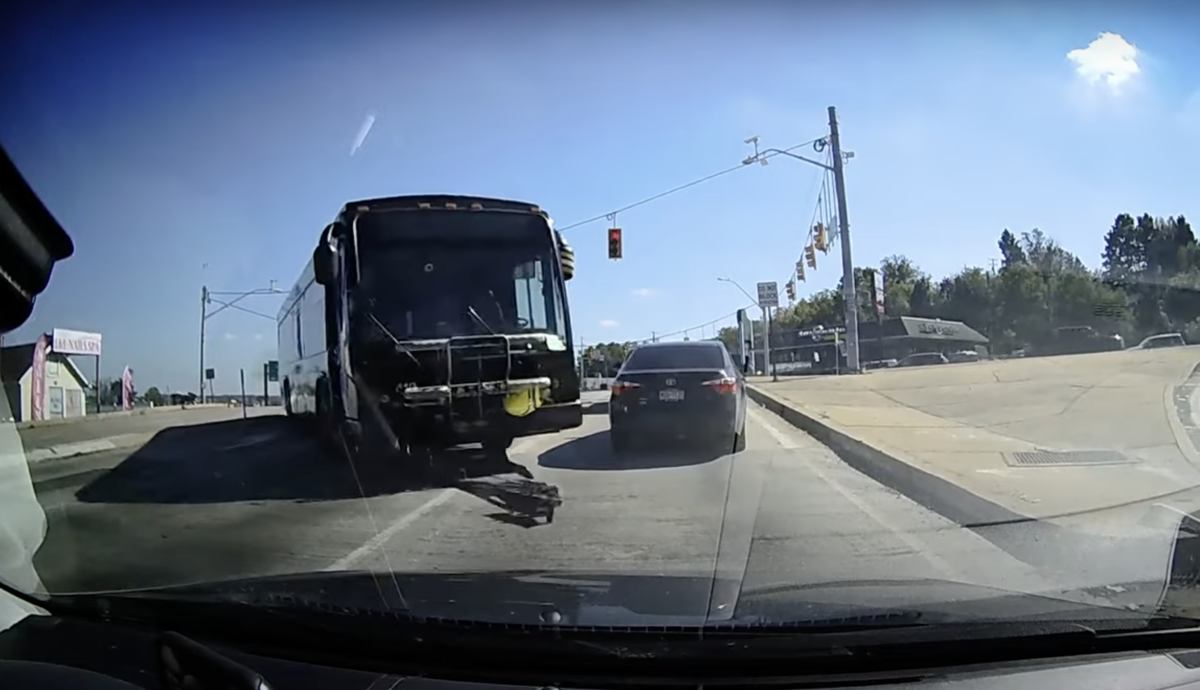 Dash cam catches runaway bus crashing through median into car