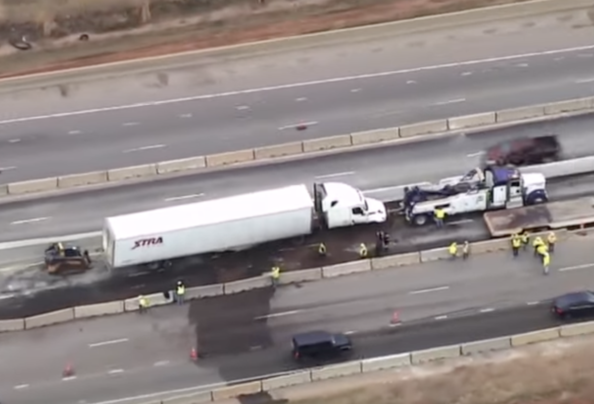 Oklahoma police officer falls off overpass while tending to semi truck crash