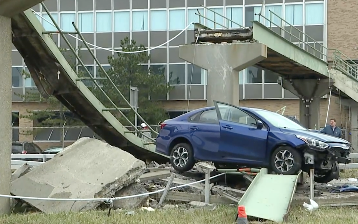 Truck decimates pedestrian bridge and innocent sedan