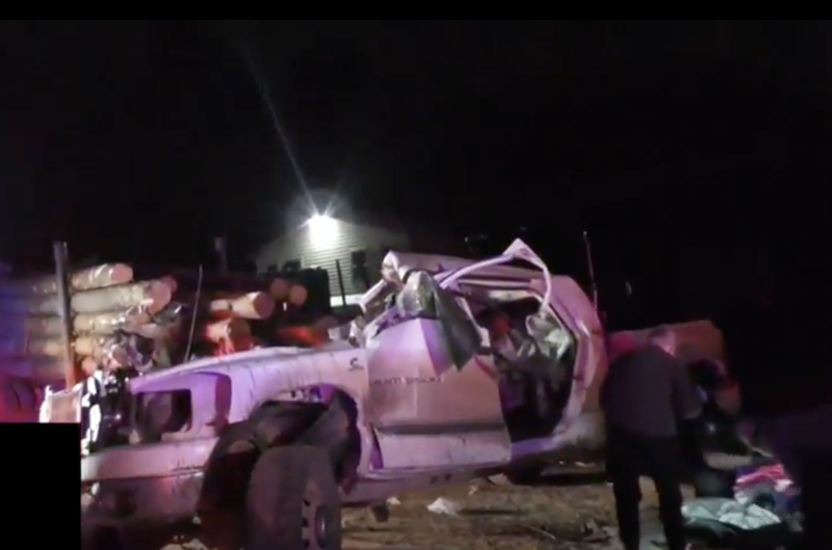 Pickup slams into back of parked log truck, killing two