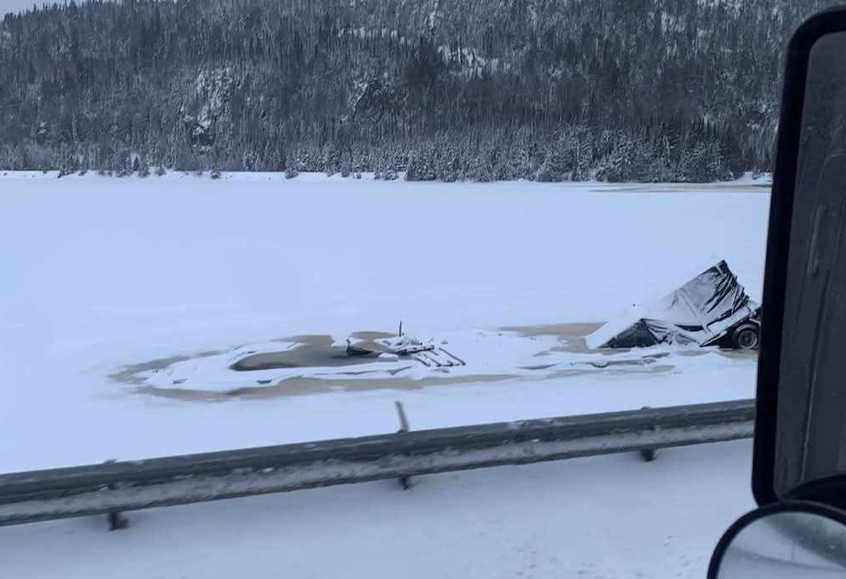 Trucker escapes rig just before it’s swallowed by icy lake