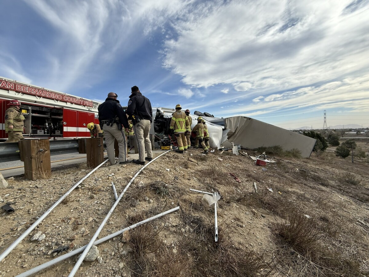 Powerful winds blow over at least a dozen semi trucks in California, one truck driver killed