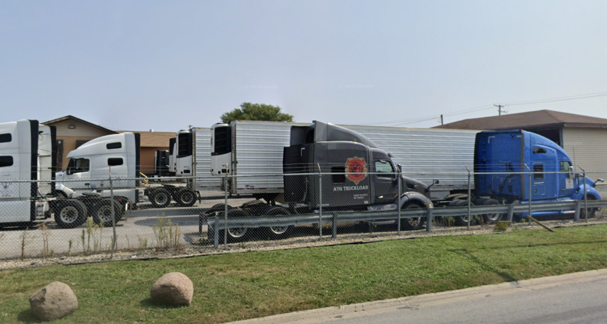 Body of trucking co. owner recovered from burning building, employee arrested at truck stop