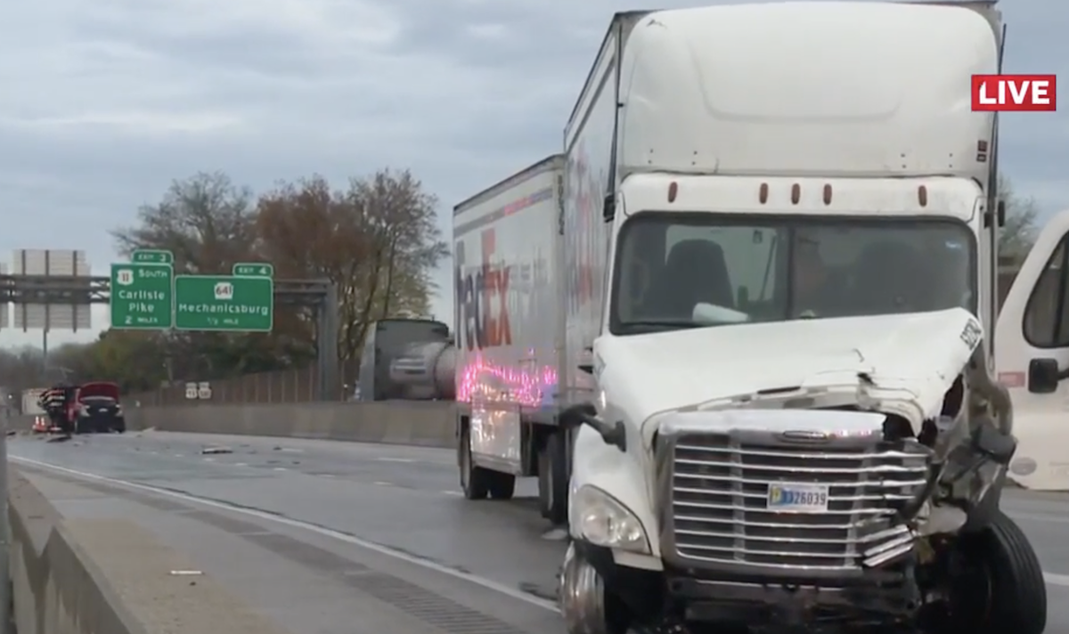 FedEx rig hauling doubles fatally strikes workers picking up cones