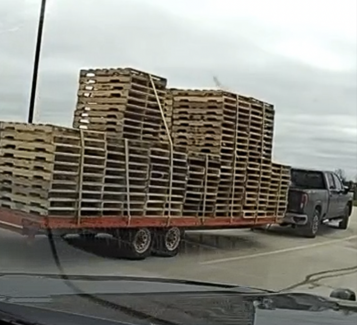 Cops stop pickup driver hauling pallets for multiple commercial vehicle violations