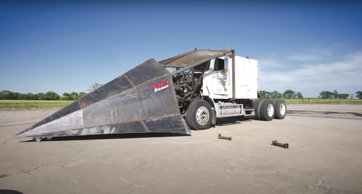 VIDEO: Guy puts a 6,000 pound plow on a 1988 Freightliner named ‘Buttercup’ and demolishes over a dozen cars with ease