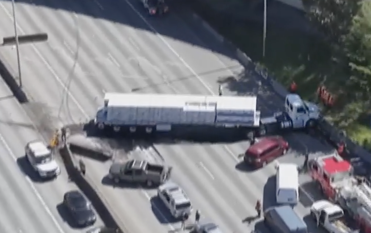 Sedan knocks off semi truck axle, causing swerve into oncoming traffic