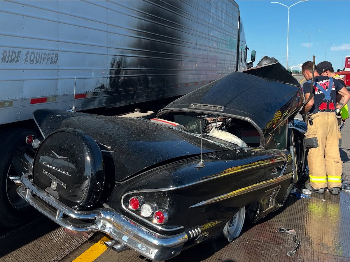 Two motorists pinned in two separate vehicles after crash underneath semi truck