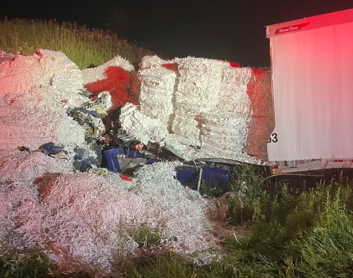 Trucker buried under bales of paper that broke through front of trailer during crash