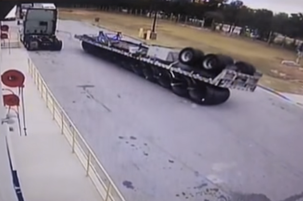 VIDEO: Flatbed trailer hauling coils flips completely upside down, but at least the straps held?