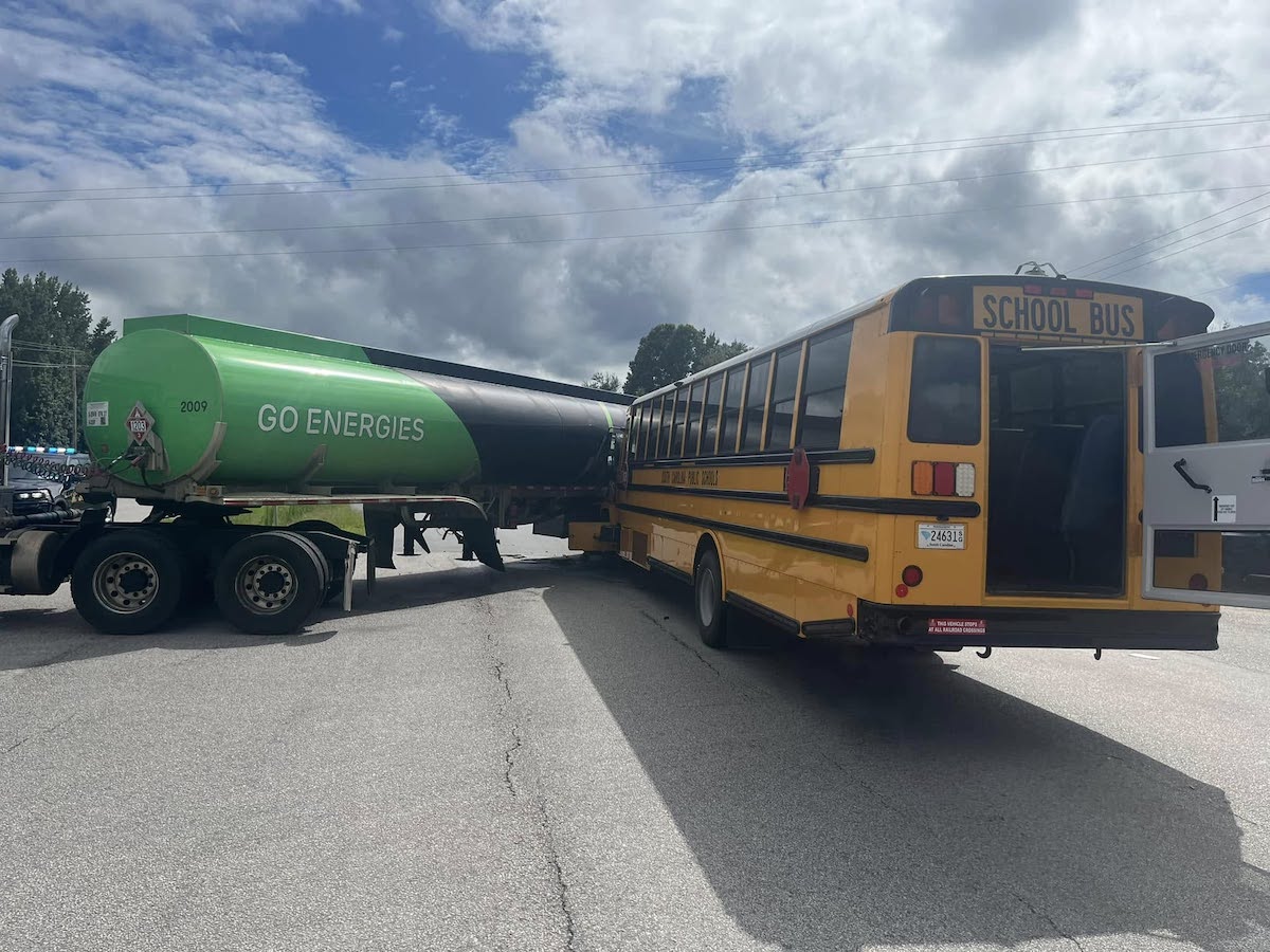 Nine people injured after school bus crashes into tanker truck leaving a truck stop