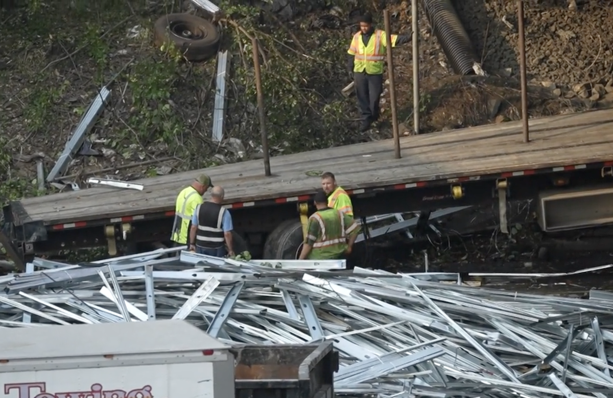 Piles of metal left along NJ roadway after flatbed veers off road