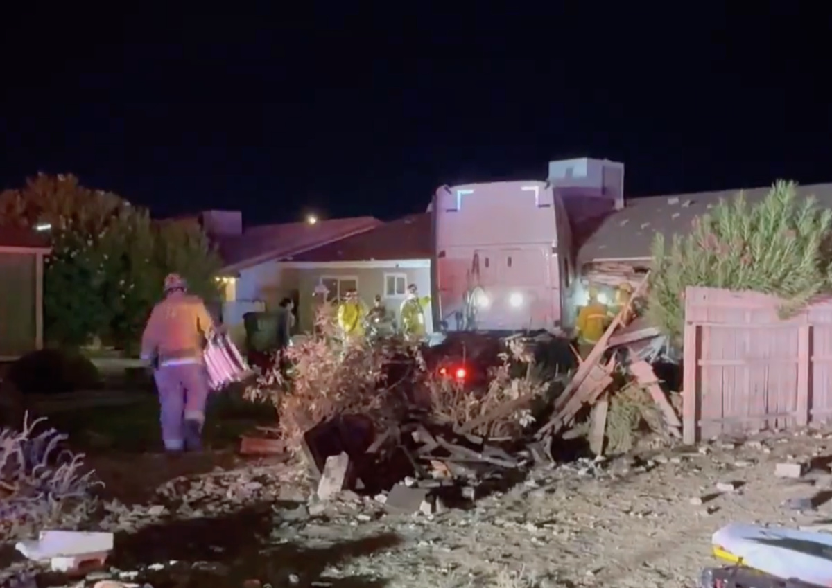 Driver flown to hospital after roof collapsed on top of him in crash into home