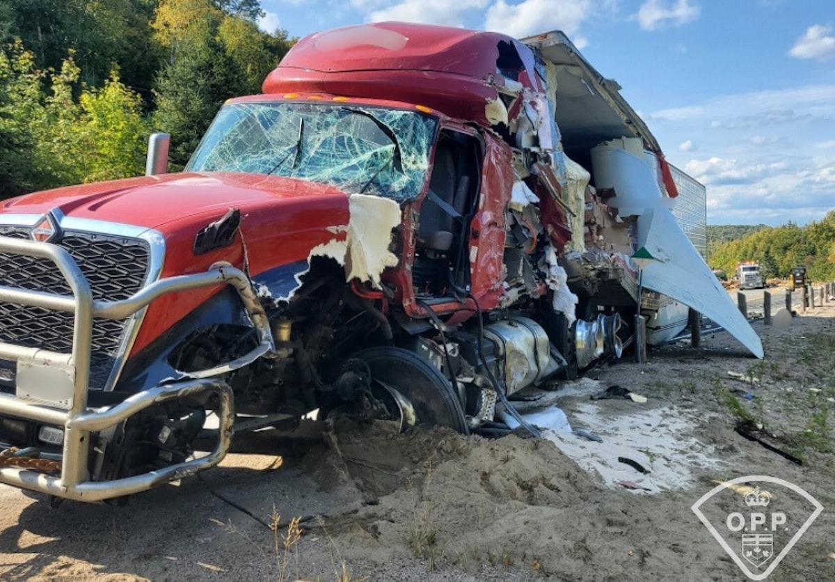 Side ripped off of tractor trailer in crash involving rig that crossed the center line