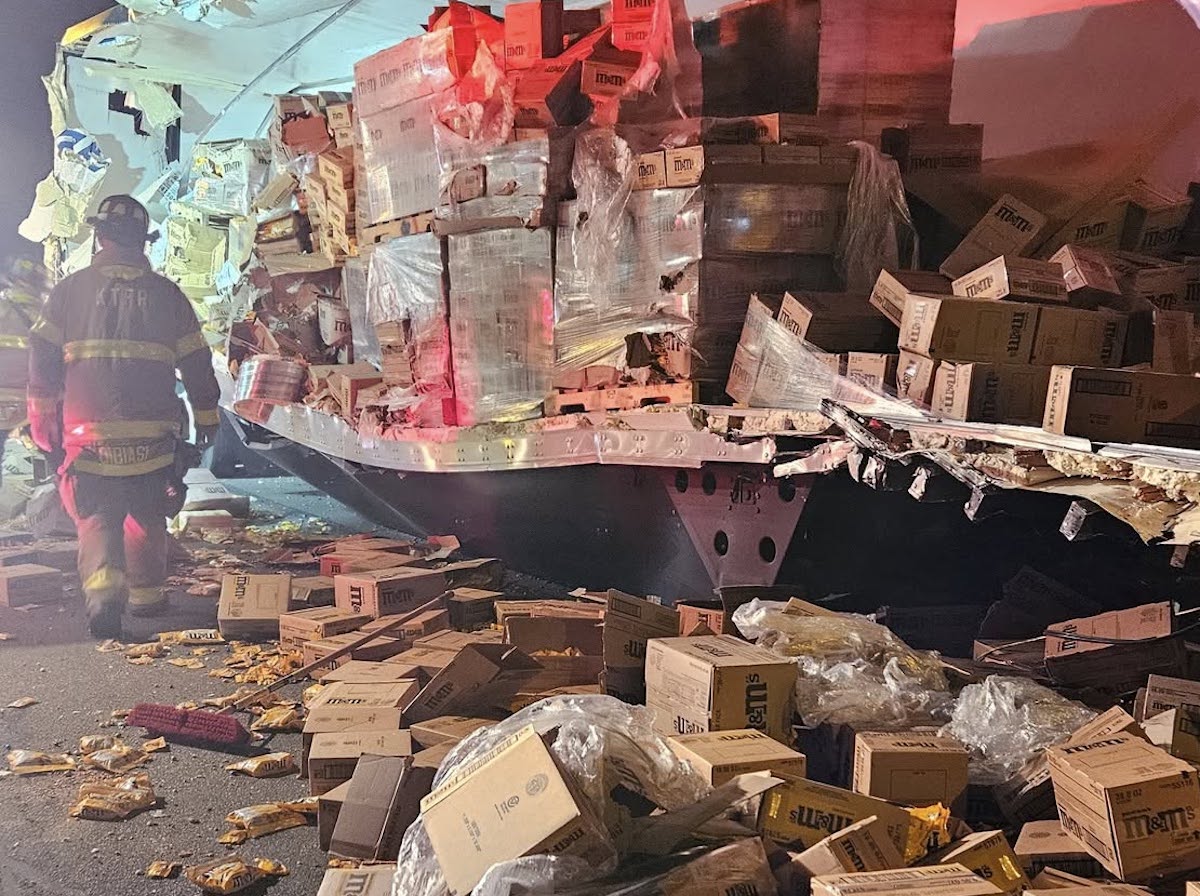Load of M&M candy spread across roadway in crash between two tractor trailers