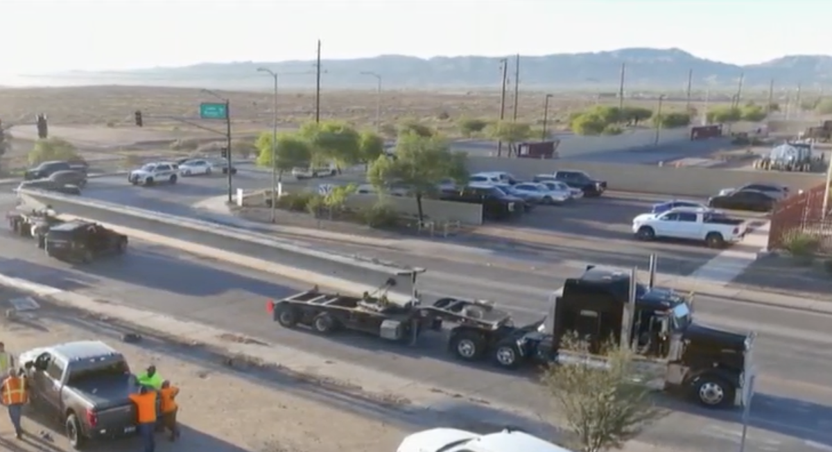 Motorist hospitalized with broken legs after crashing into concrete pillar oversize load
