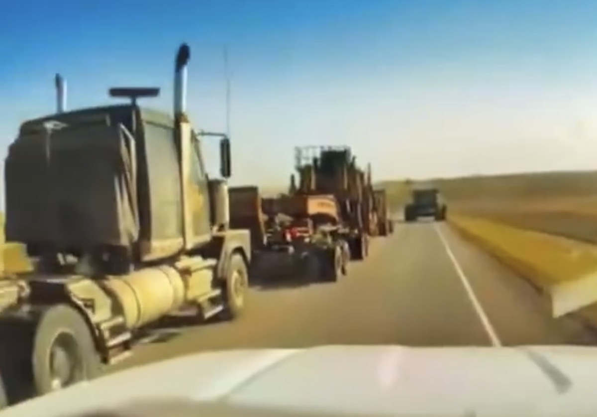 VIDEO: Wide load flicks combine harvester into ditch on rural road