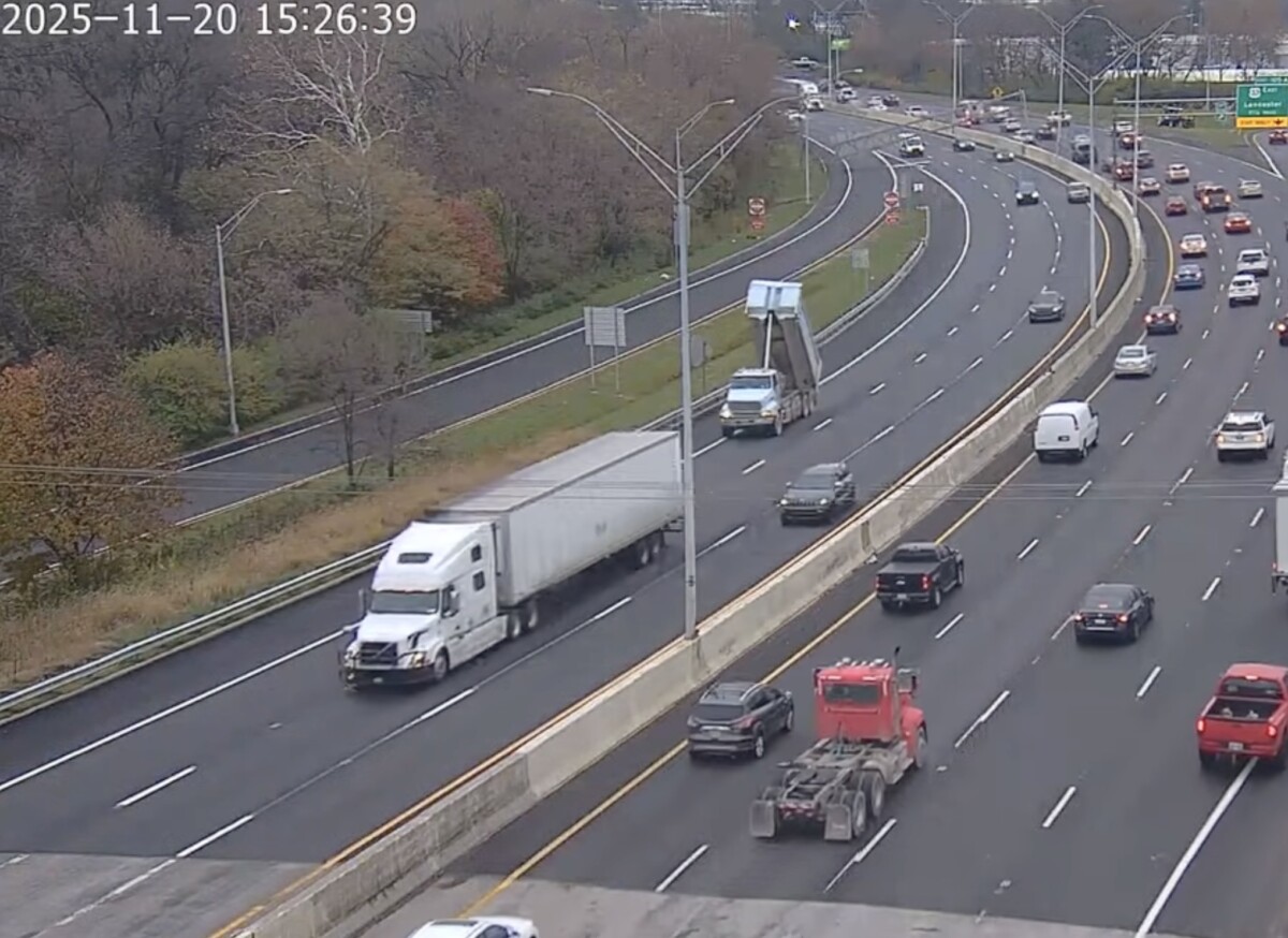 Ohio DOT video shows dump truck with raised bed striking and collapsing highway sign on I-70