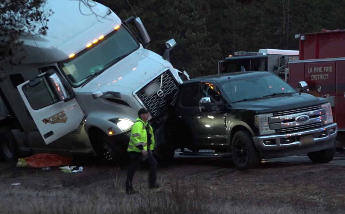 Semi truck left resting on bed of pickup after multi vehicle crash