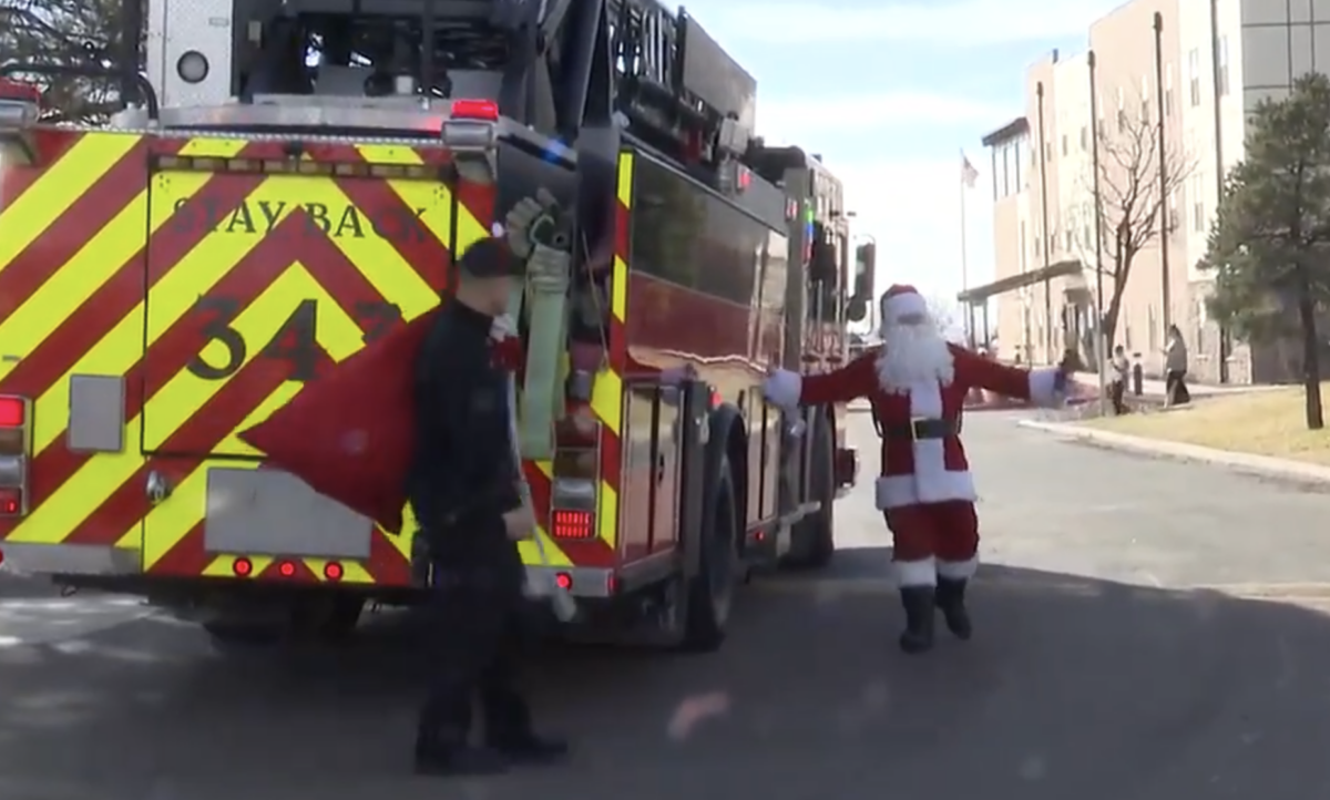 Santa hitches ride on fire truck for Colorado meet and greet