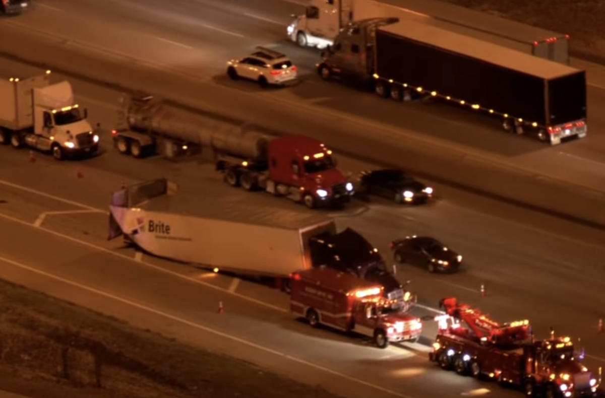 Rear end of beer-hauling semi truck collapses in crash with passenger vehicle