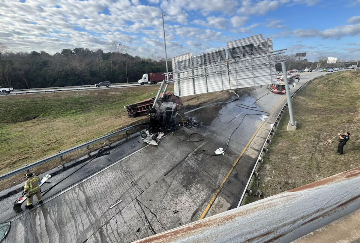 Driver says he was searching for his TWIC card before flipping his truck and downing pole