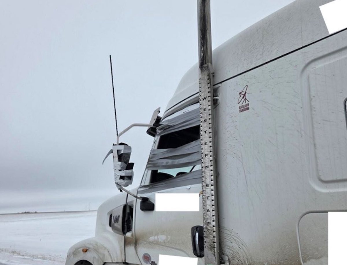 Officer tows semi truck with cab held together by duct tape