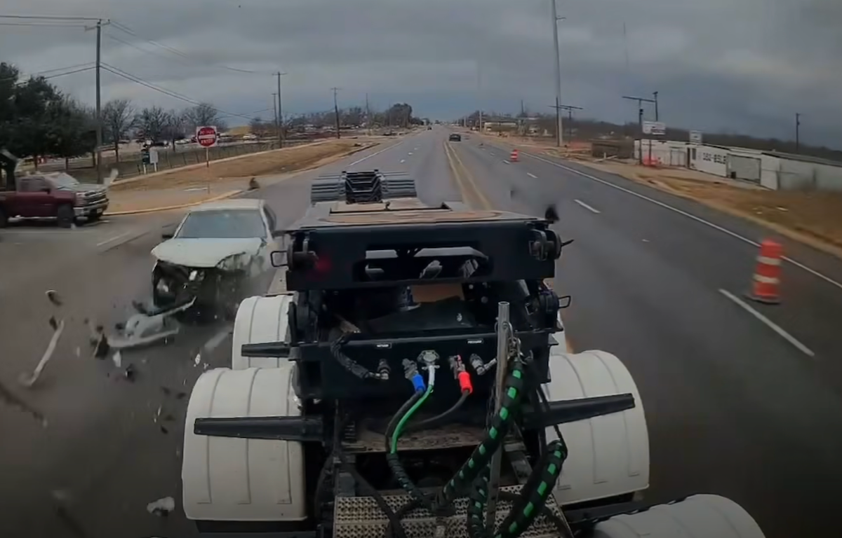 Flatbedder does his best to avoid sedan that just pulled out in front of him