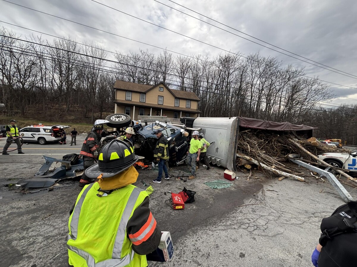 Multiple people trapped in nine vehicle pileup crash involving truck hauling tree debris