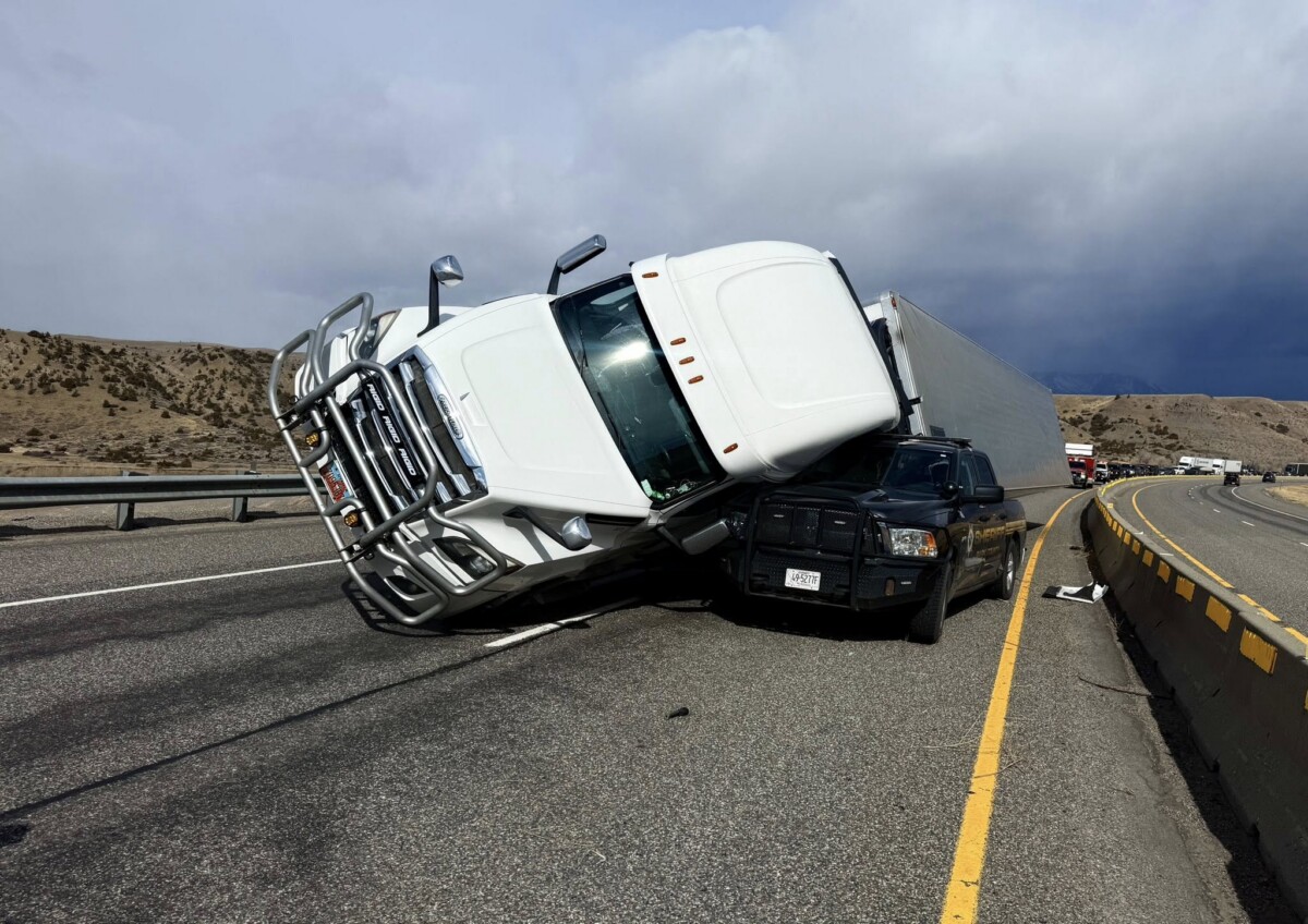 Semi truck blown over onto sheriff’s deputy patrol vehicle on Montana interstate