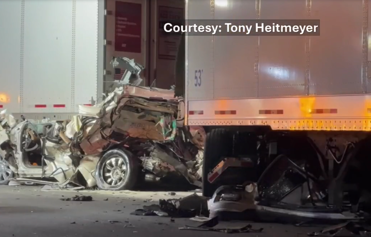 Troopers investigating semi truck crash into stopped traffic that killed father & son on I-75