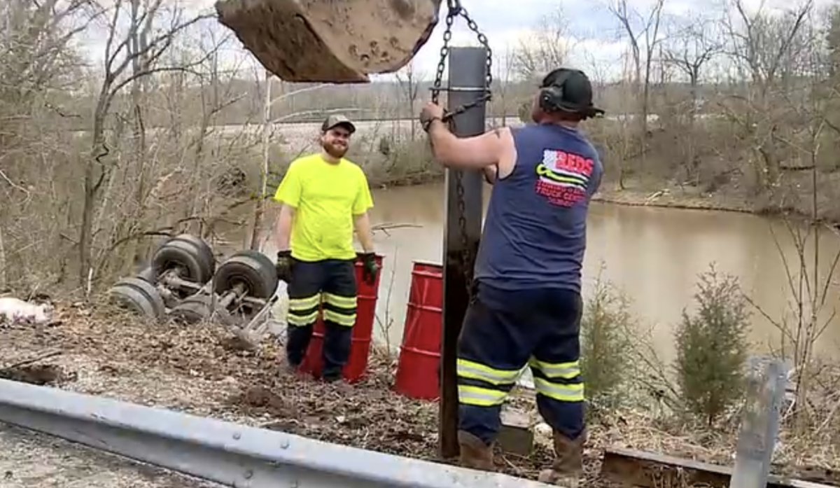 Trucker trapped upside down underwater flown to hospital after rescue by fellow driver