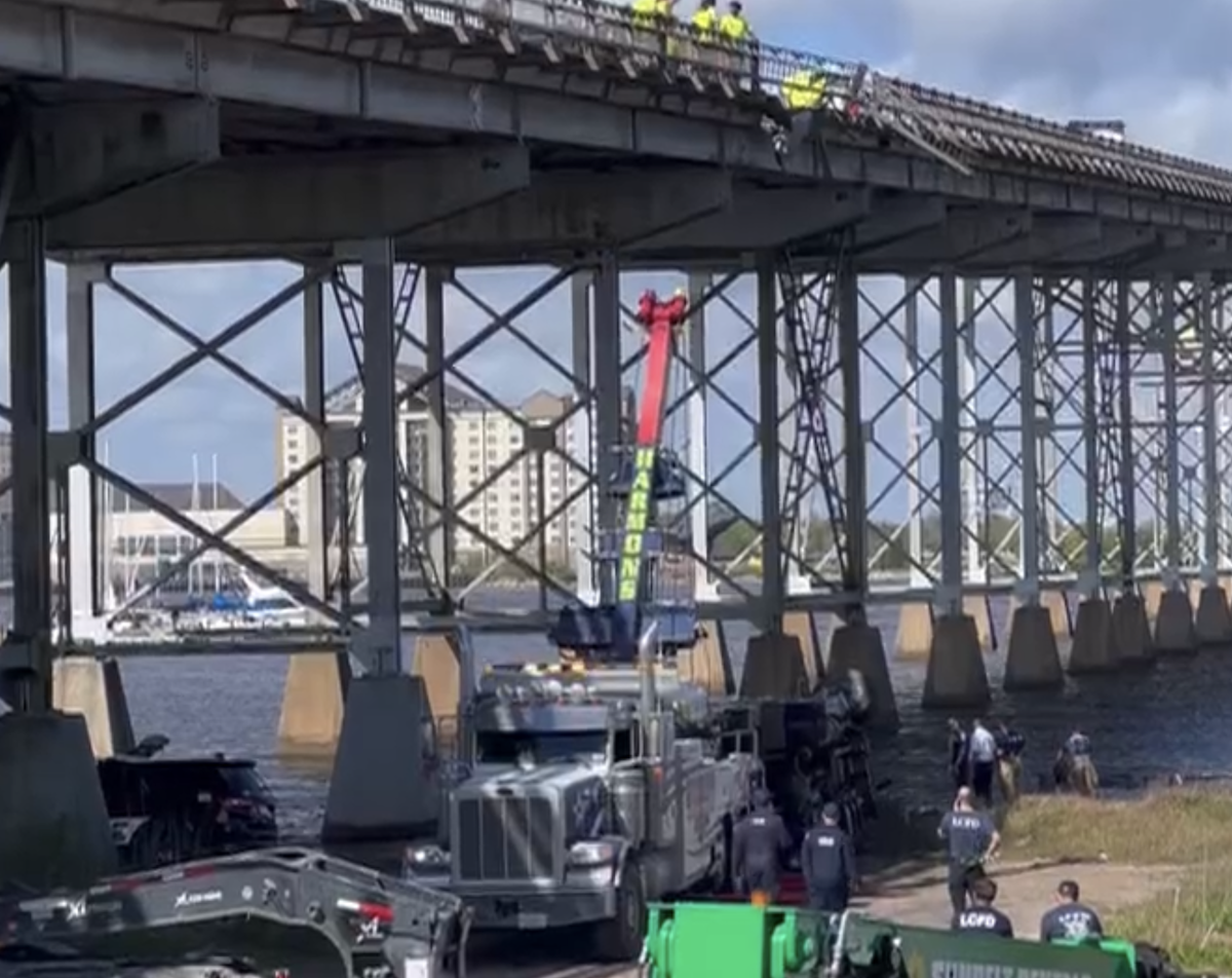 Bucket truck driver survives after skidding off side of Calcasieu River Bridge to avoid previous wreck
