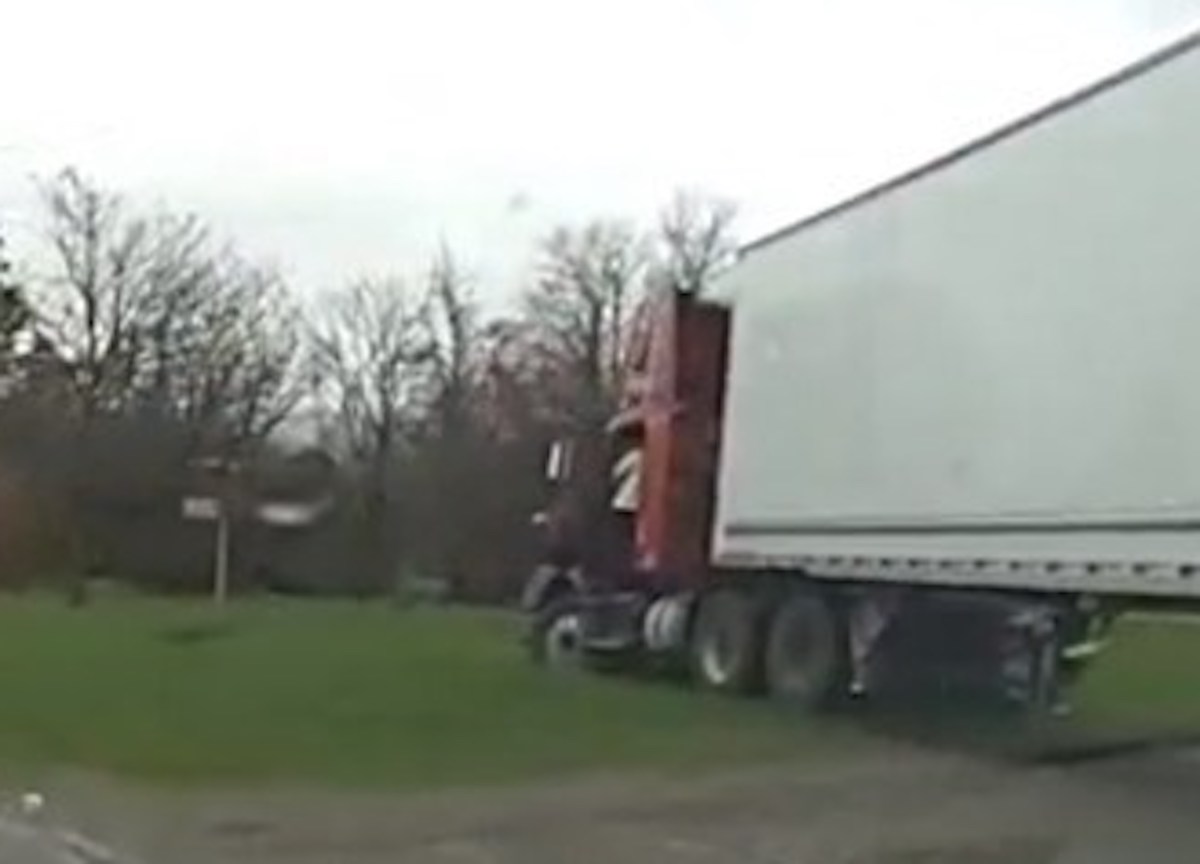 CMV placed out of service after getting stuck in front yard