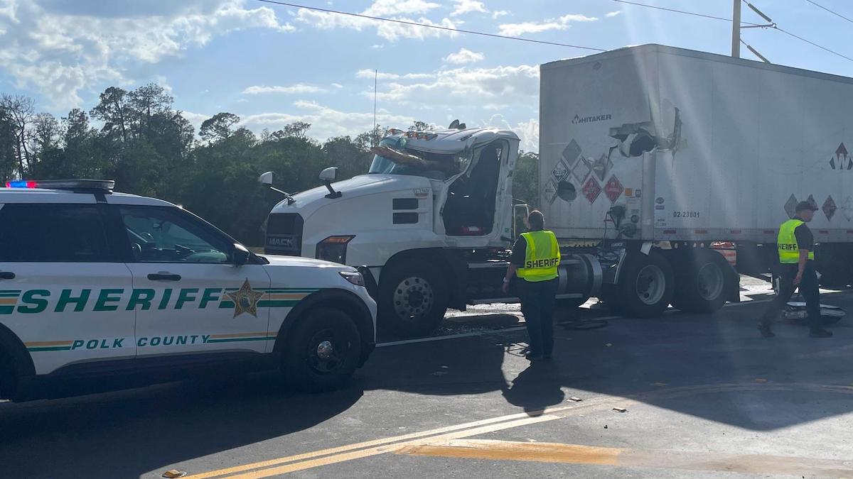Distracted trucker killed after driving into load of timber during lane change