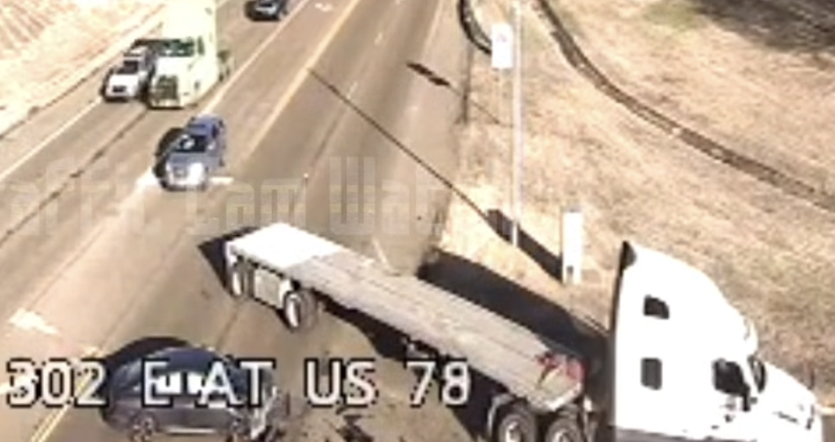 VIDEO: Four-wheeler crashes into flatbed turning left