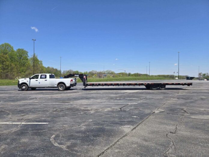 ISP image of pickup with trailer pulled over for 99 mph speed violation