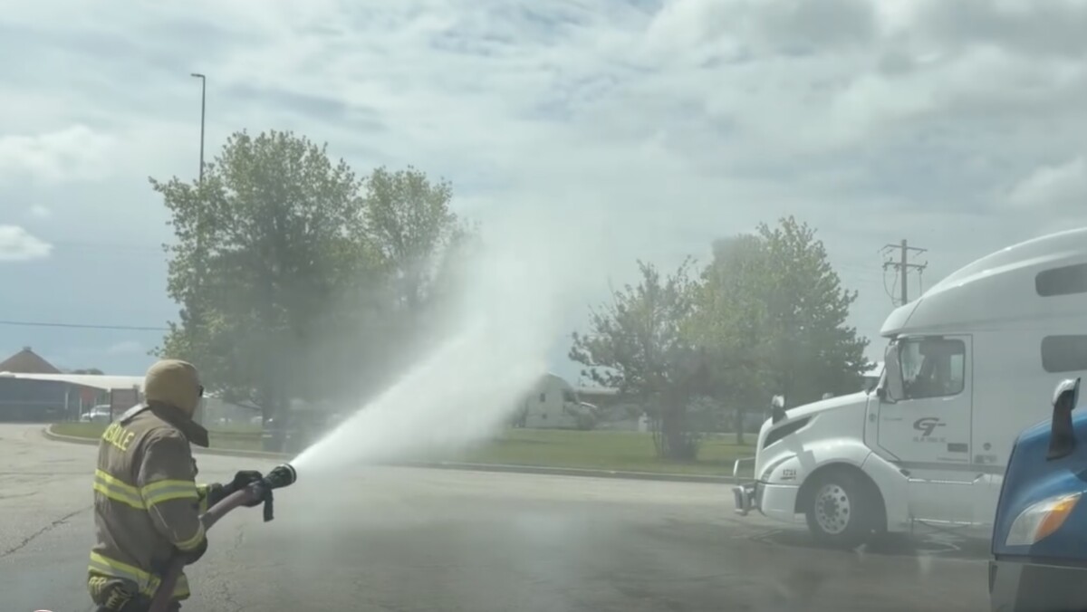 Video shows firefighters helping semi truck driver with bad bee situation at Illinois Flying J