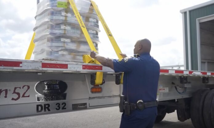 Louisiana trooper examines cargo securement