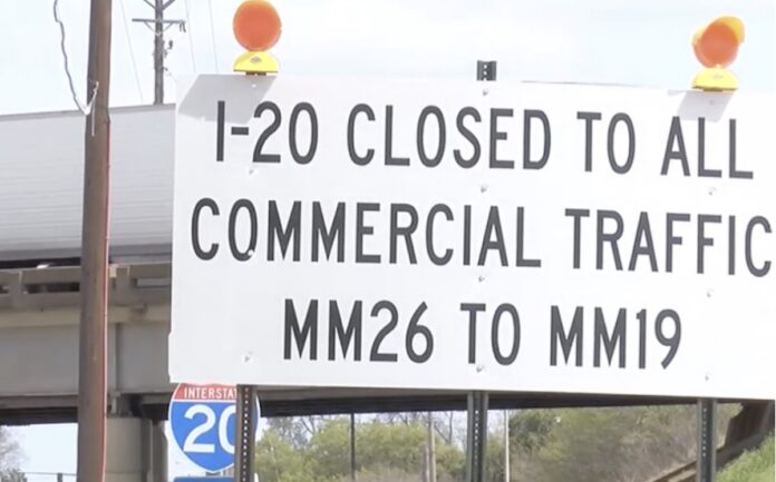 Image of sign on I-20 in Louisiana banning trucks