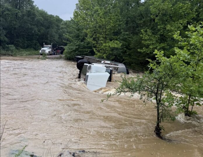 OHP image of gravel truck stranded by floodwaters
